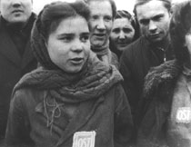 Woman
                        worker from Eastern Europe with an OST badge