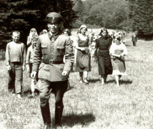 Soviet women forced labourers on a
                          controlled walk with their children