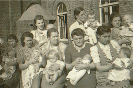 East European working women with babies
                          in front of a children nursing station for
                          eastern workers at Ochtrup