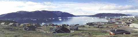 Greenland:
                  example of Narsaq: mountains, houses, sea, but no
                  trees