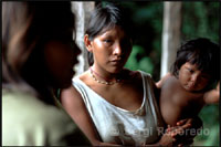 Native people in a
                        settlement in the Orinoco River delta