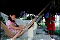 Native people in a
                        settlement in the Orinoco River delta