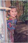 Maya natives in Guatemala:
                            child with a traditional dress