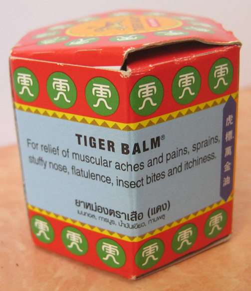 The box of tiger balm indicating the
                      applications and healings