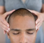 Healer's hands
                        on a patient's head