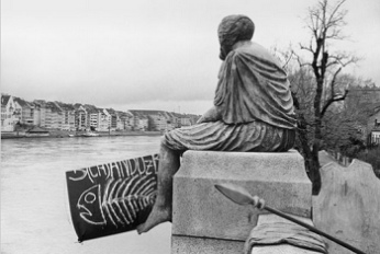 Sandoz is
                                    a Shamedoz (orig. German: Schandoz),
                                    poster of a demonstration put to
                                    Helvetia statue at Central Bridge in
                                    Basel
